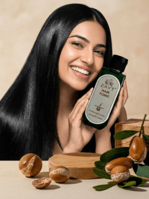 How to apply ZAYT Hair Tonic: Gently massaging the herbal oil into the scalp to improve blood circulation.