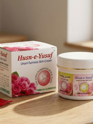 A close-up e-commerce photo of Husne Yusuf Cream, flanked by fresh red roses and an herbal mortar and pestle, emphasizing natural radiance.