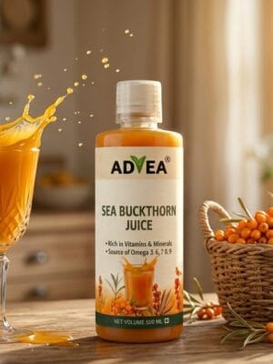 A bottle of ADVEA Sea Buckthorn Juice next to a splashing glass of juice and a basket of fresh orange berries.