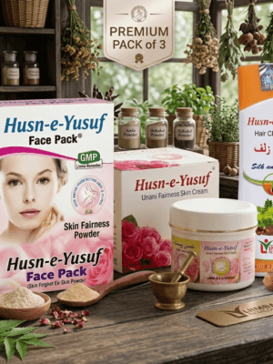 A box of Husn-e-Yusuf Face Pack, a jar of Fairness Cream, and a bottle of Husn-e-Zulf Hair Cleanser arranged on a wooden table.